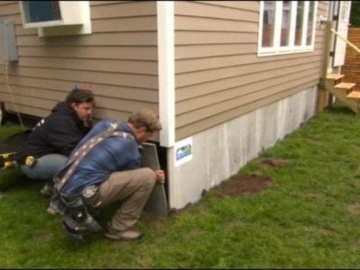 Inspector evaluating a manufactured home foundation system